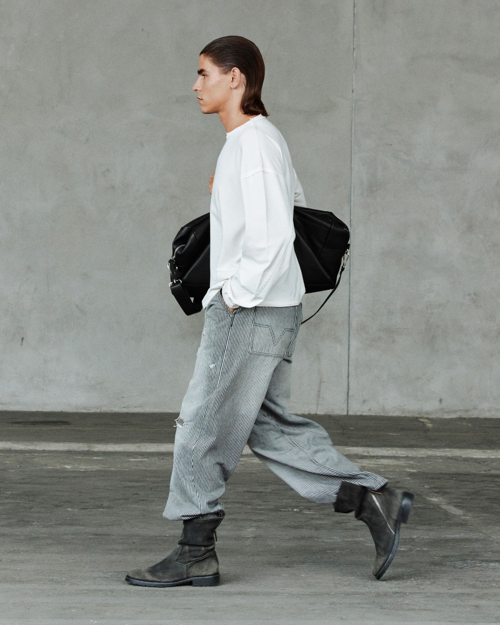 FW26 runway — white long sleeve, wide grey trousers