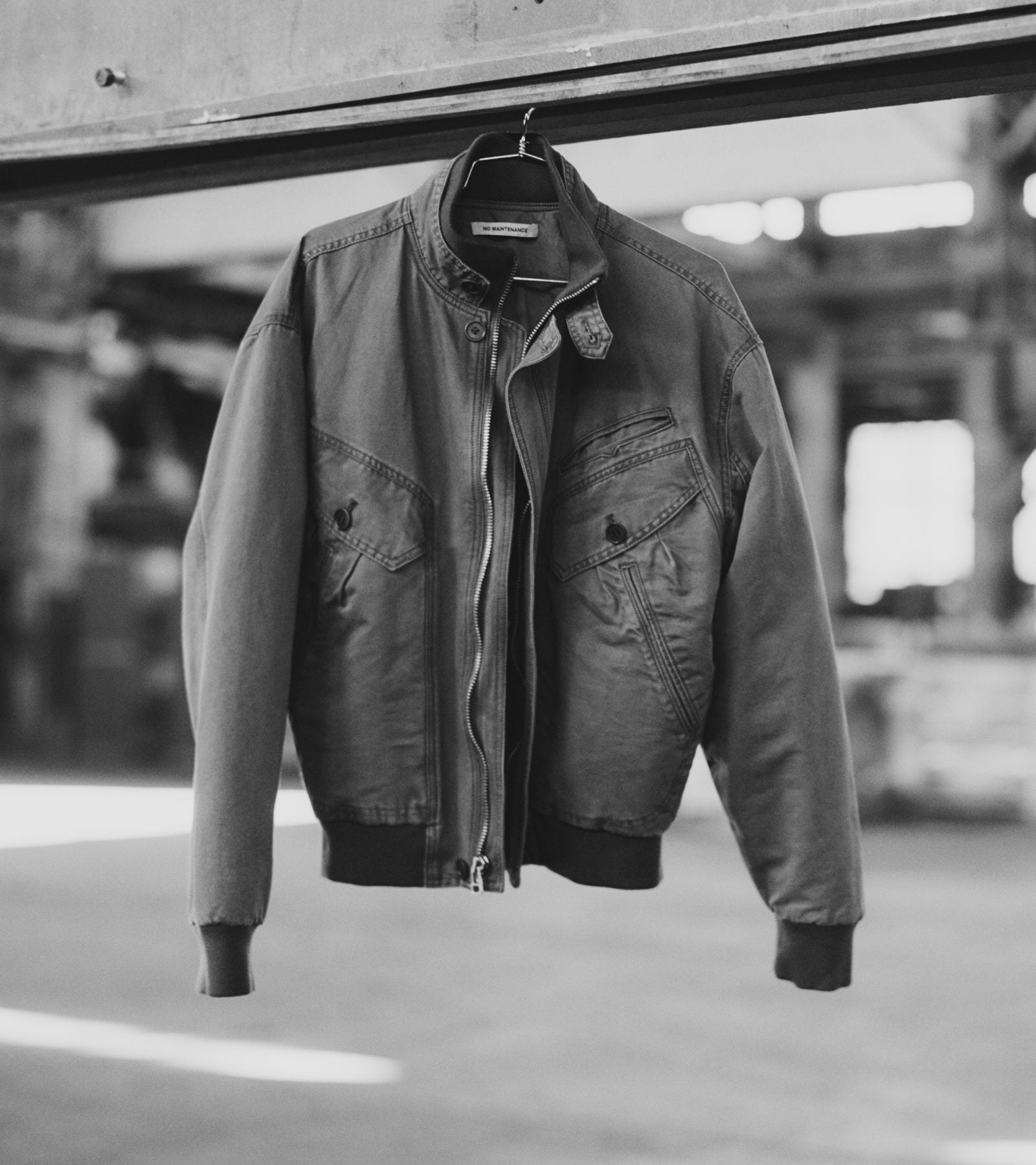 FW26 — bomber jacket hanging in the warehouse